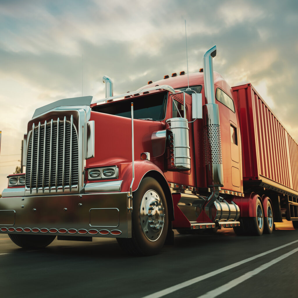 Red intermodal truck with shipping container